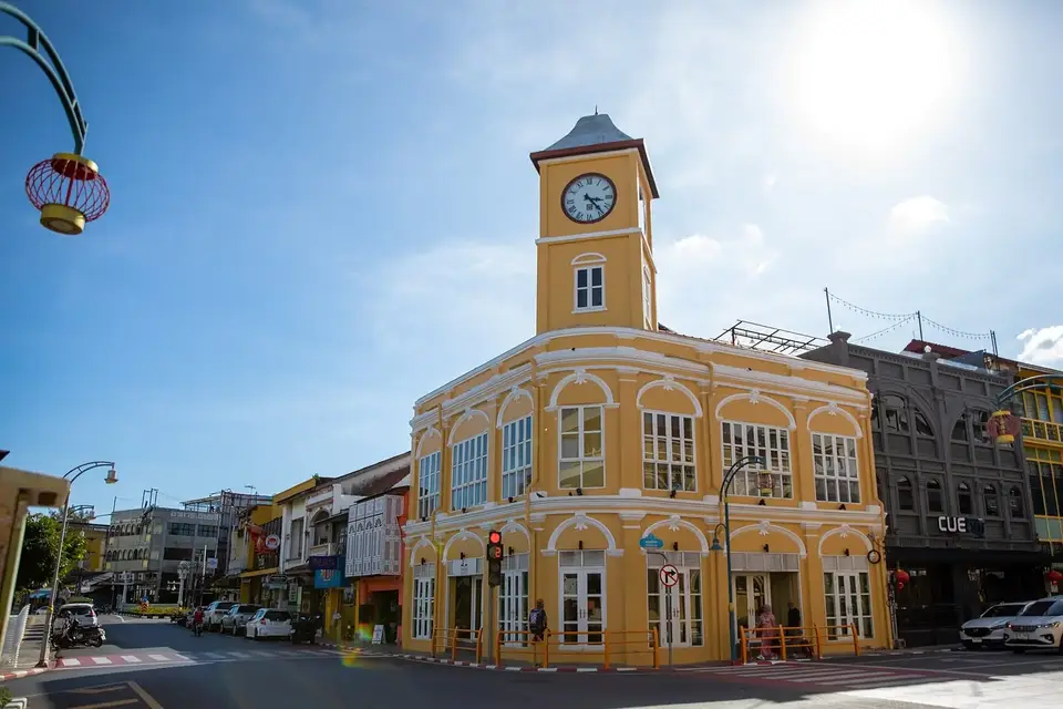 The yellow colonial clock-tower building on a corner in Phuket Old Town