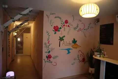 Aloha Massage Chiang Mai: corridor with painted floral mural and lantern