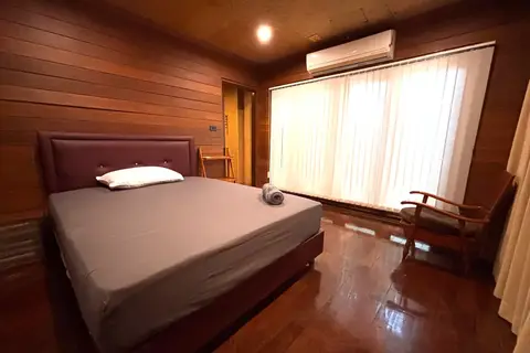 House of Nox: wood-panelled room with a bed and window