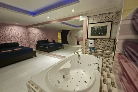 Katherine Massage: room with a bed and large jacuzzi